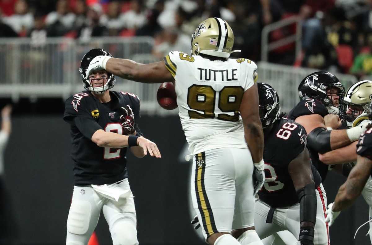 Nov 28, 2019; Falcons quarterback Matt Ryan (2) throws an interception to Saints defensive tackle Shy Tuttle (99). Mandatory Credit: Jason Getz-USA TODAY